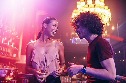 Happy couple in the night club