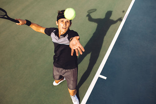 Tennis player Tossing the ball for the serve