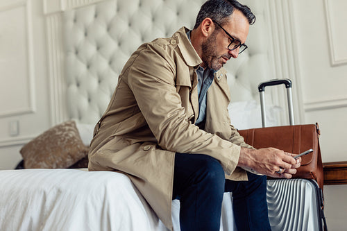 Businessman resting in hotel room after the journey