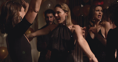 Rich women enjoying dancing at night club