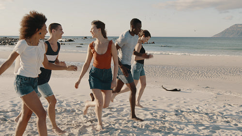 Friends running and enjoying on the beach vacation