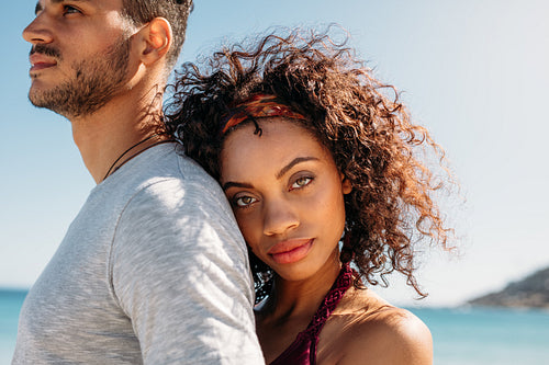 Close up of a woman holding her boyfriend from behind