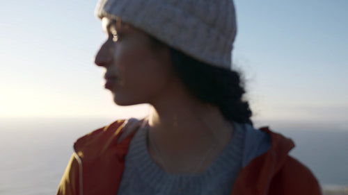 Girl looking away standing outdoors on winter day