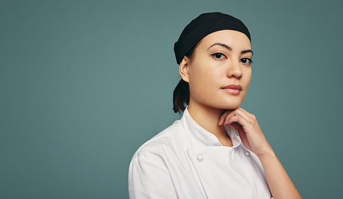 Kitchen chef looking at the camera in a studio