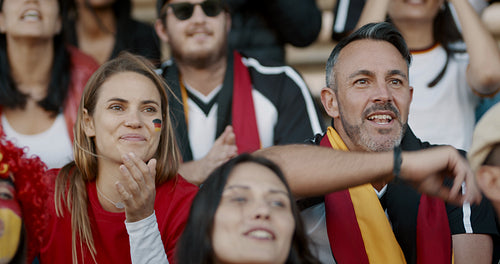 Football supporters in fan zone celebrating a goal