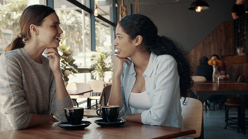 Best friends meeting in a cafe