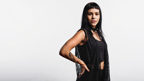 Goth woman with tattoo and piercings