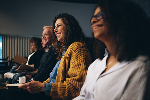 Group of business people sitting at seminar