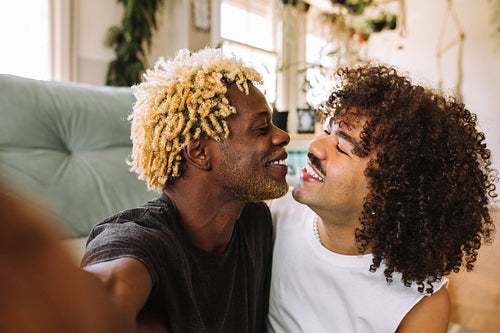 Sweet gay couple taking a selfie together