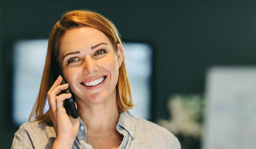 Successful businesswoman speaking on a phone call