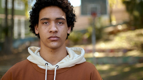 Closeup of a teenager staring at camera