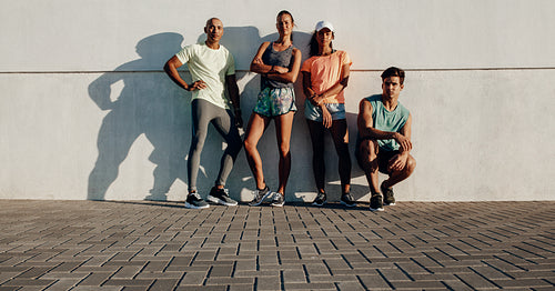 Fitness group standing together after workout