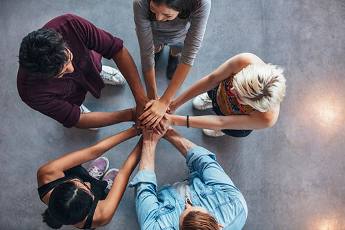 Students making a stack of hands