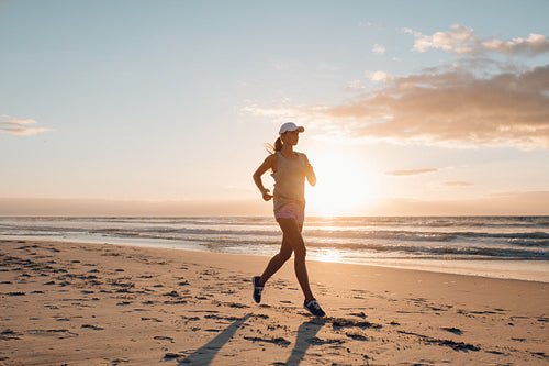 Fit young female running on the beach