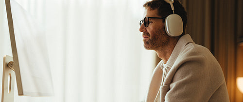 Focused mature professional doing deep work at computer