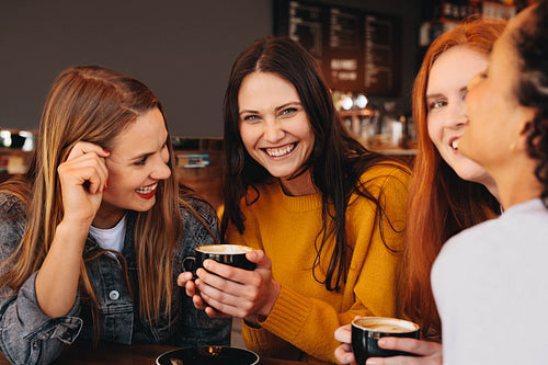 Woman with friends at a coffee shop
