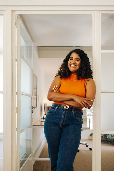 Happy female entrepreneur smiling at the camera