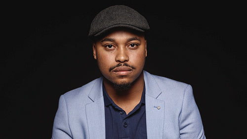 Portrait of a man wearing a cap