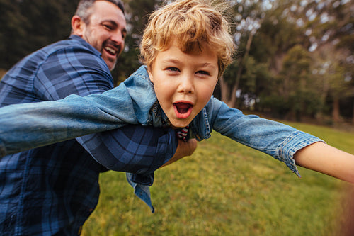 Son with his father having fun in park