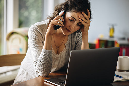 Stressed woman making a phone call