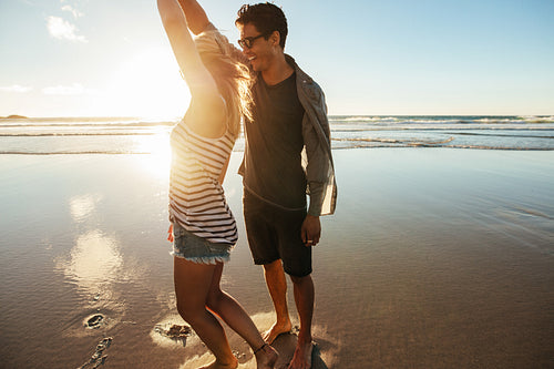 Loving couple dancing on the shore