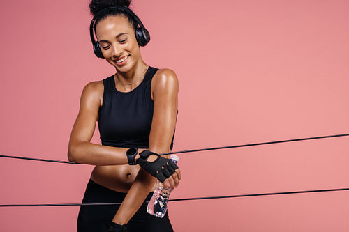 Smiling woman resting after workout