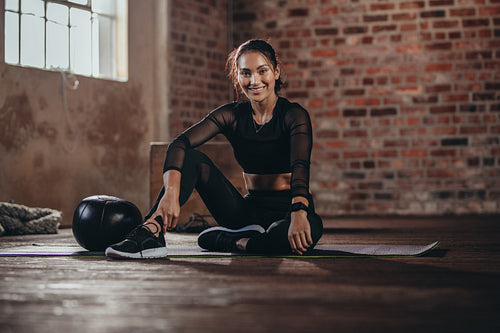 Woman during a break in the gym