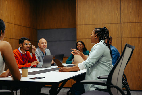 Boardroom discussion at an accounting firm with diverse team