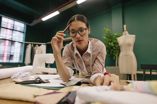 Woman dressmaker working in her studio