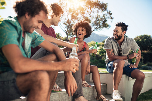 Group of friends in garden having fun
