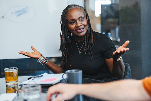 African business woman discussing with her colleagues in a meeting