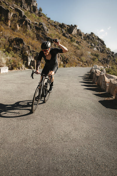 Cyclist cools his head while riding