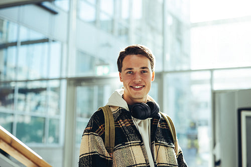 Young man standing at university campus