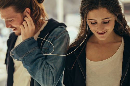 Close up of a smiling couple listening to music