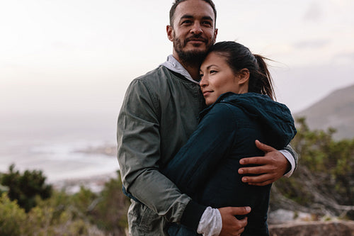 Couple in love embracing in nature