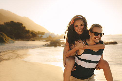 Tourist couple having fun on the beach