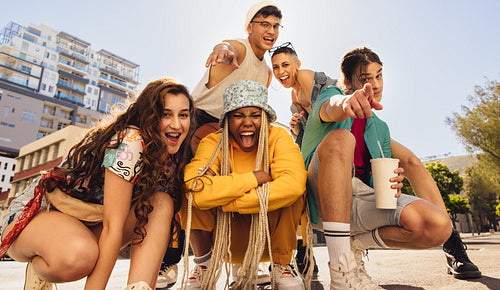 Energetic group of friends having fun in the city