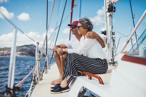 Happy mature couple enjoying a boat ride together