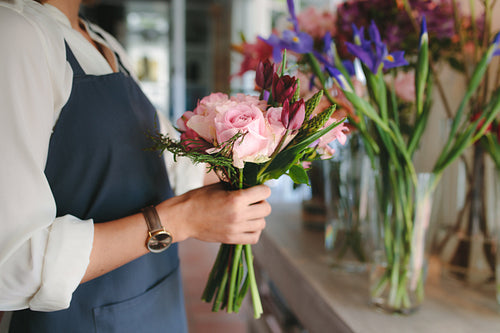 Female florist hands holding flowers