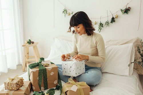 Woman opening her christmas presents