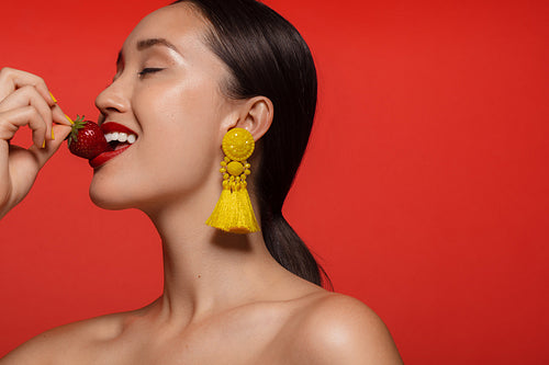 Woman having fresh strawberry