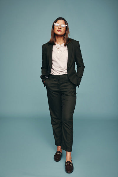 Confident young woman standing in a studio