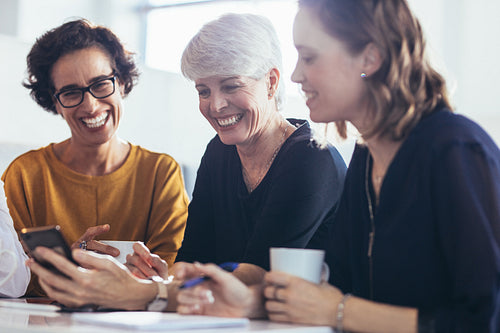 Three businesswomen during break at office