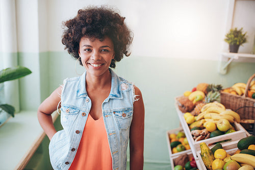 Portrait of happy young juice bar owner