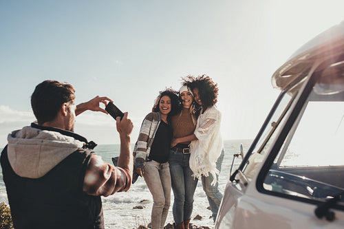 Friends on road trip taking pictures