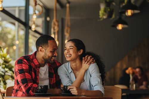 Loving couple having a conversation at coffee shop