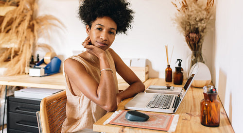Woman at workdesk in ornament studio