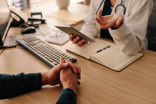 Female doctor consulting male patient