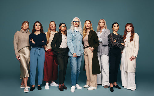 Self-confident women standing together in a studio