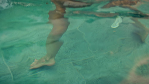 Joyful family moments as parents and children splash and play in a luxurious villa pool